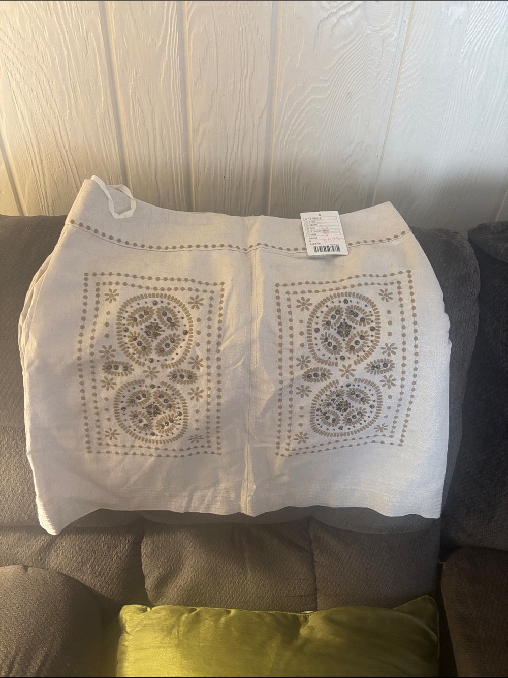 Floreat White Garment with Yellow Floral Label